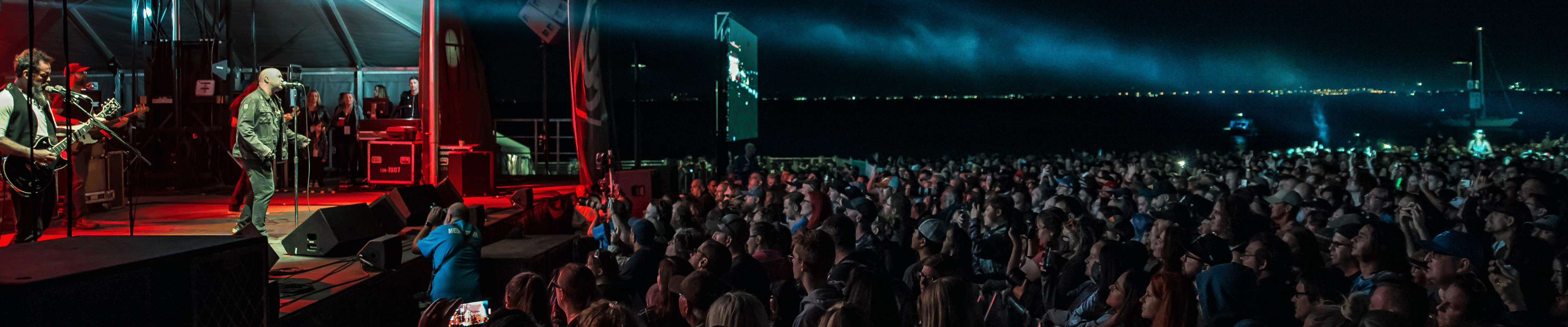 image of crowd watching performance at night