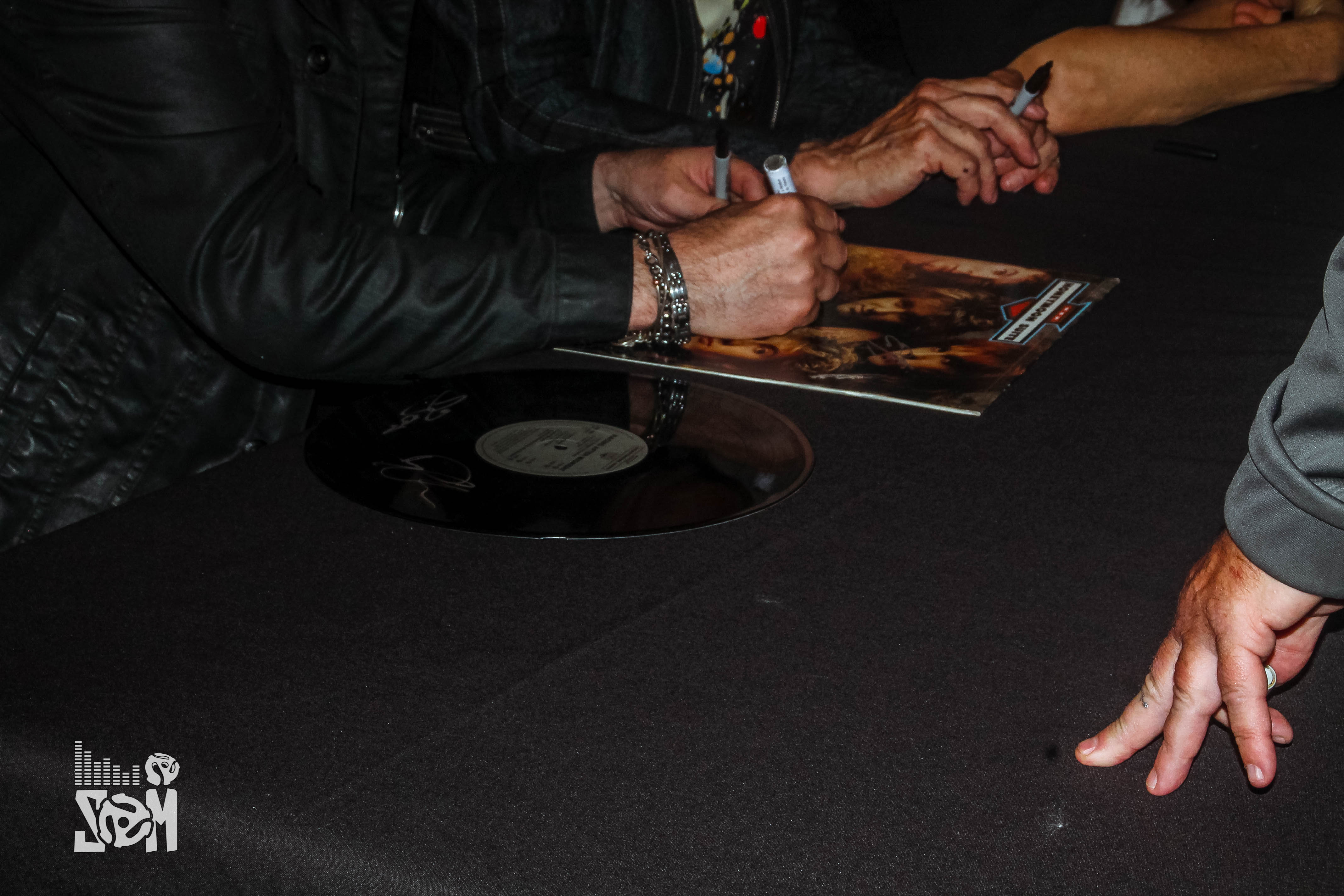 image of artist signing record